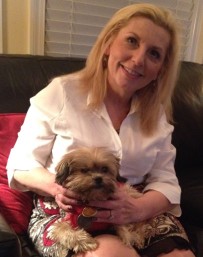 Gracie in her forever home with Roberta, her adopter